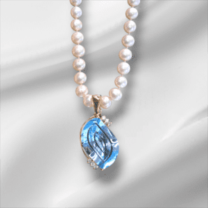 Pearl Strand Necklace with Unique Blue Topaz Enhancer